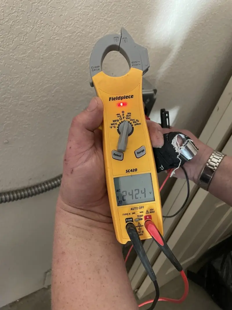 Voltage testing with clamp meter during Electrical Installation Services in Ferguson
